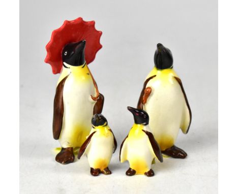 BESWICK; a figure group of a penguin family, to include lady penguin with umbrella, penguin and two penguin chicks (4). CONDI
