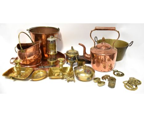 A quantity of copper and brassware to include a twin-handled tray with circular motif to the centre, a safety lamp, a small c