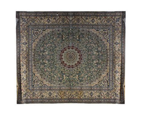 A large Persian/Iranian Nain carpet/large rug, with a centred sunburst circular panel set within a large oval naturalistic fl