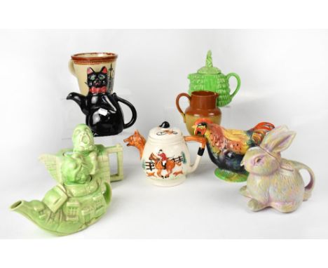A group of vintage collectible teapots of various form, to include a mid-20th century rooster, the Old Lady who Lived in a Sh