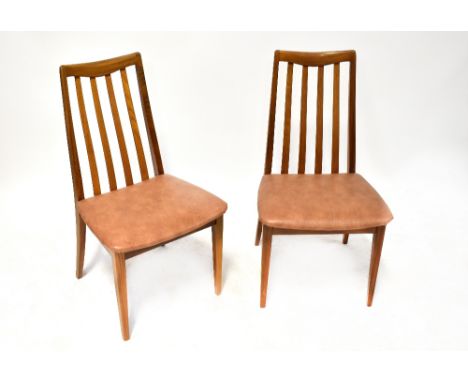 G-PLAN; a set of four slat back dining chairs raised on square sectioned tapering supports (4). CONDITION REPORT Three of the