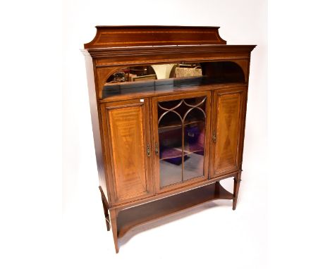 An Edwardian mahogany inlaid display cabinet, stepped frieze above single shelf with mirror back, above central astragal glaz