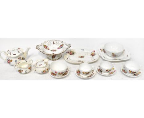 A c1900 Coalport part tea/dinner service with typical hand-painted floral decoration on white ground, to include teapot, sucr