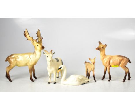 BESWICK; a stag no.981 standing, doe 99A and fawn 1000B, all in light brown, together with a swan and a Nigerian pot-bellied 