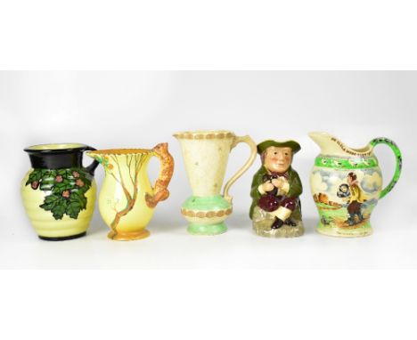 Various collectible mid-20th century pottery to include a Charlotte Rhead jug with ribbed body and painted leaves and blossom