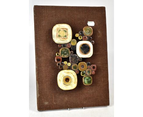 ANNE PLANT (born 1934); a c1970s ceramic sculpture on hessian 'Tambac', 36 x 26cm. † CONDITION REPORT This lot may qualify fo
