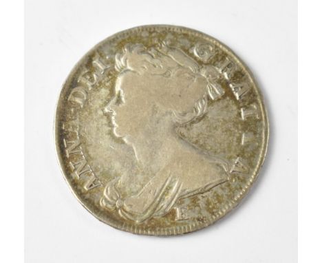 A Queen Anne 1707 silver half crown, 'E under bust' to the obverse, the four shield to the reverse. CONDITION REPORT All lett