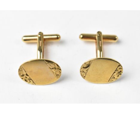 A pair of vintage gentlemen's 9ct gold oval cufflinks, with blank central panel with floral decoration top and bottom, with s