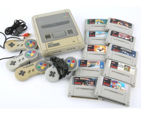 Nintendo Super Nintendo (SNES) console, 4 official controllers and 10 loose games (PAL) Games include: Pilotwings, F-Zero, To