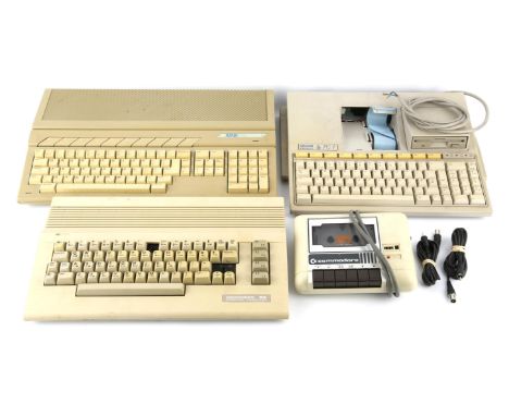 An assortment of retro gaming/computing hardware items To include: Atari 520 ST, Commodore 64, Commodore Tape Player/Datasett