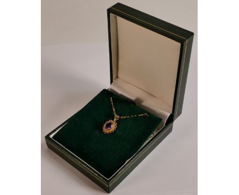 9ct gold amethyst oval pendant and chain, 2g. 