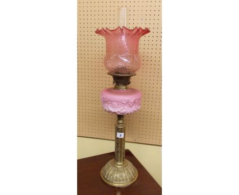 VICTORIAN BRASS AND GLASS OIL LAMP WITH CRANBERRY FLARED SHADE AND PINK RELIEF MOULDED OPAQUE RESERVOIR 71CM H