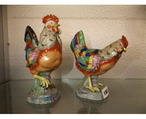 PAIR OF POTTERY HEN AND COCKEREL FIGURES IN BRIGHT ENAMEL COLOURS - TALLEST FIGURE IS 21CM H