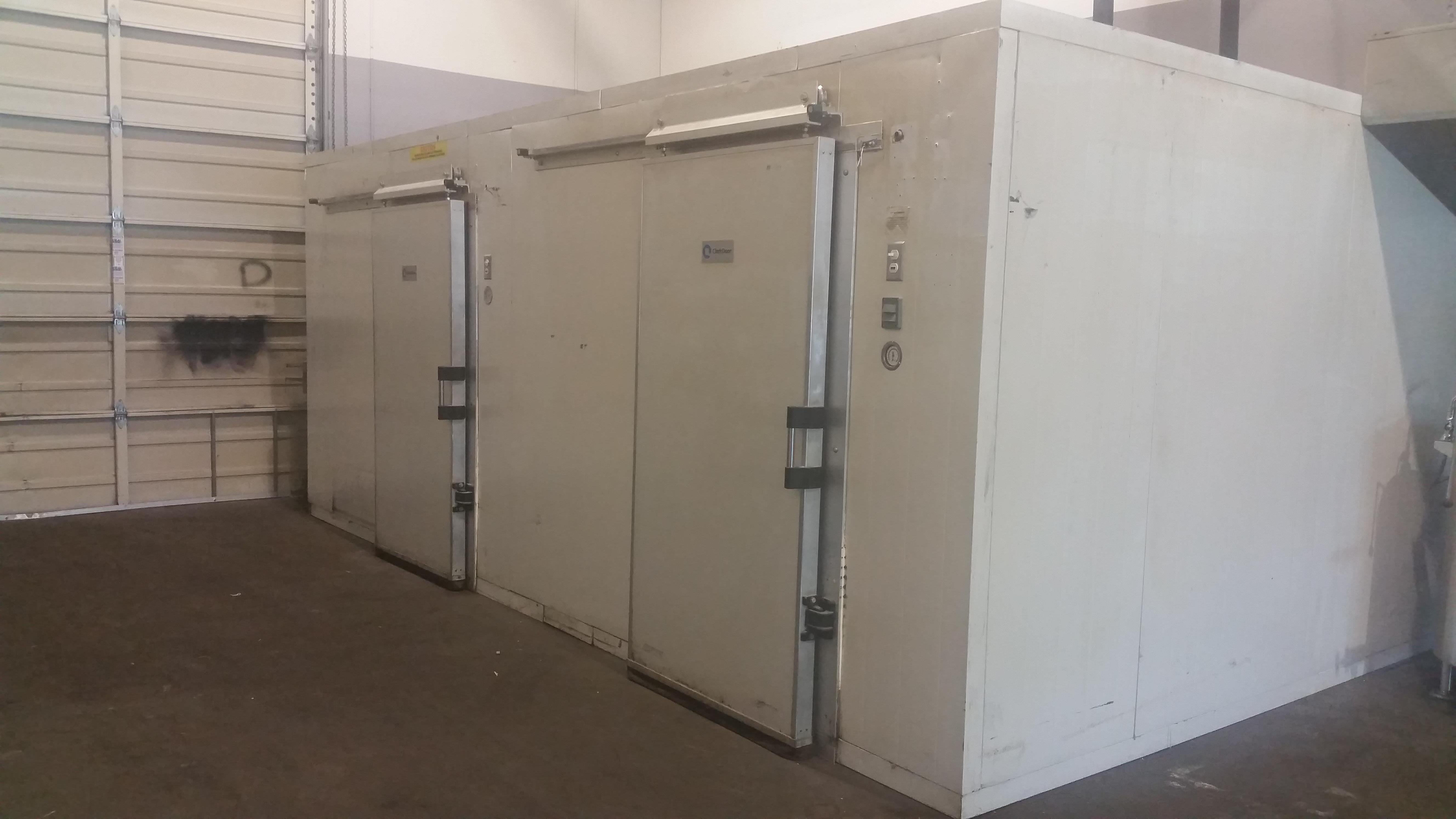 Approx 18 ft x 10 ft walk in freezer / cooler combo. Complete with Clark rolling heated doors. 2