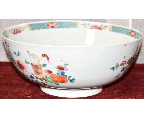 A ceramic bowl with floral design and decorative border. Some damage - slight chips and design worn in centre. H=11, W=26cm