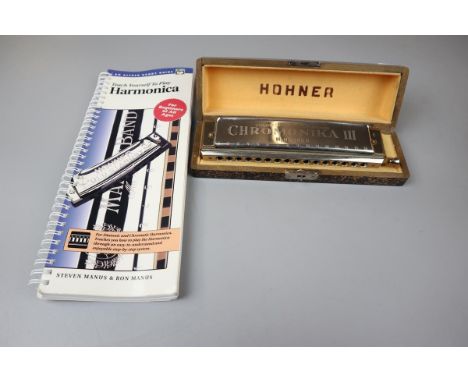 Hohner harmonica together with a teach your self to play book 