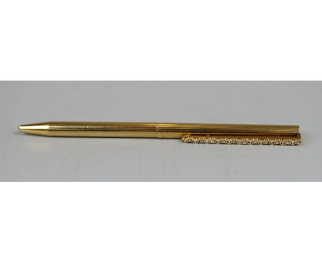 A French classique ballpoint pen, the slender 18ct gold body having decorative clip with 22 claw set brilliant cut diamonds, 