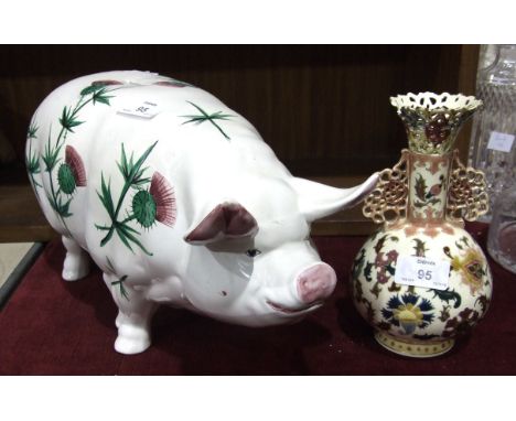 A large Wemyss-style ceramic pig money box decorated with thistles, 40cm long, 20cm high and a Zsolnay baluster and reticulat