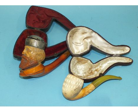 A large meerschaum pipe, a bearded gentleman with white metal hat, 18.5cm long, cased and another meerschaum pipe, (2).