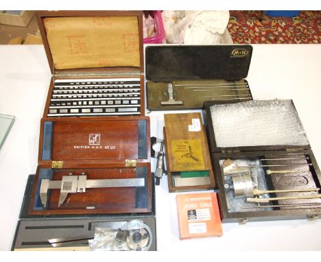 A collection of engineering tools, including Moore &amp; Wright micrometers, precision ground square, Johansson blocks and a 