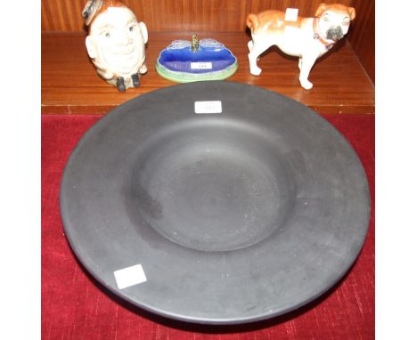 A Royal Doulton 'Wright's Coal Tar Soap' dish decorated with a dragonfly, 16cm wide, a ceramic figure of a pug, a pottery Hum