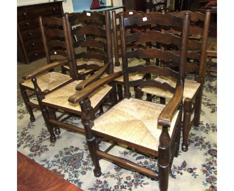 A set of six elm ladder-back chairs with rush seats, includes two armchairs, (6).