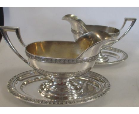 A pair of German '800' standard silver sauceboats with fitted saucers total weight 27.6ozt (2)  