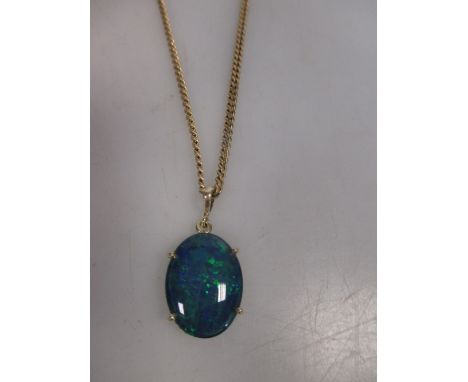 An oval opal triplet pendant in a four claw mount, stamped 585, on a chain marked 375  