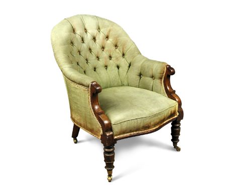 A William IV rosewood framed armchair, button upholstered in green satin, on turned legs and brass casters, 86cm high x 64cm 