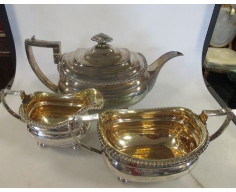 A George III silver three piece tea set by Emes & Barnard, London 1816, the teapot of plain rectangular form with gadrooned r