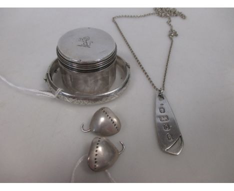 A pair of silver earrings, a pendant on chain, a bangle and a silver topped dressing table bottle  