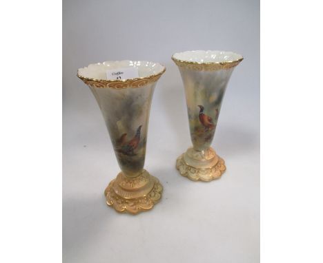 A pair of Royal Worcester vases painted with pheasants and signed by James Stinton, shape number G706, 16cm high 