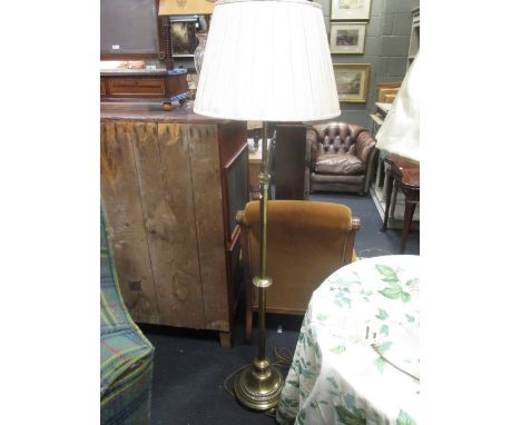 A brass height adjustable floor standing lamp standard  