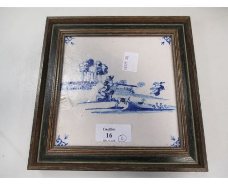 A framed display of three Delft tiles and a blue and white tile (4)  