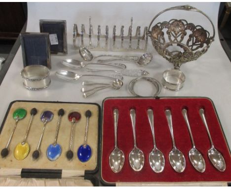 A pair of silver toastracks, Sheffield 1932, three Victorian silver salt spoons, a cased set of six silver gilt bean-end coff