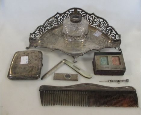 A silver half galleried and engraved desk inkstand, London 1899, with glass bottle (top lacking), a silver pocket cigarette c