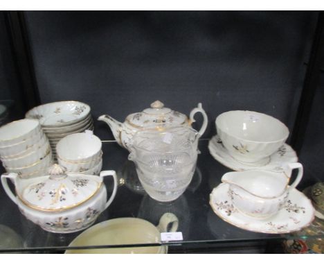 A Chamberlain's Worcester part tea set, ten bowls, twelve cups, a teapot, sucrier, sauceboat etc and a pair of wine glass rin