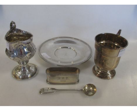 A silver christening mug, Birmingham 1922, engraved, a George III silver cream jug, London 1773, a silver napkin ring, Cheste