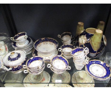 A Staffordshire tea and coffee service, comprising sucrier and cover, slop bowl, two side plates, eight cups, twelve tea cups