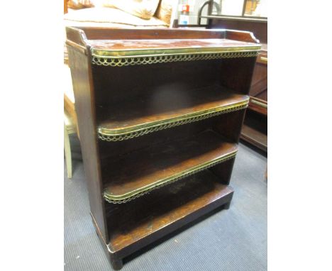 A Regency mahogany open front bookcase with pierced brass decoration to the shelf fronts, 85cm wide  