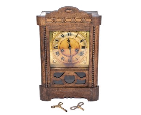 An oak mantel clock