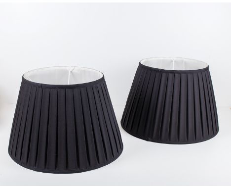 Two black pleated lamp shades, 36cm tall