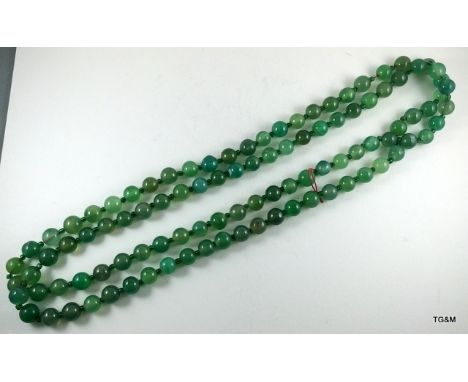 A Jade necklace 140cm long