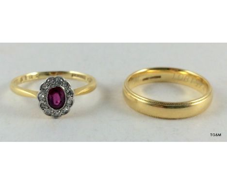 An 18ct gold diamond and ruby ring and 9ct gold wedding band size N