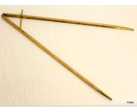 A beech Pace Stick with brass mounts