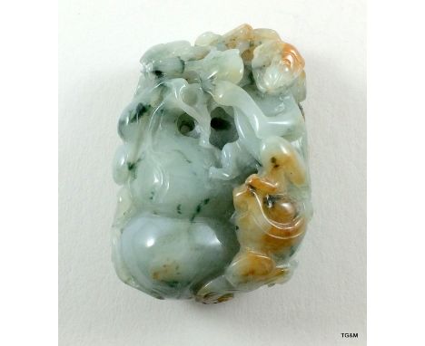 A carved Jade depicting monkeys