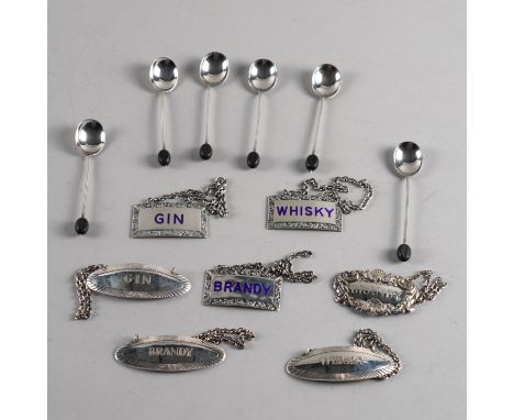 SEVEN SILVER DECANTER LABELS AND A SET OF SIX COFFEE SPOONS (13)Comprising; three curved rectangular and blue enamelled decan