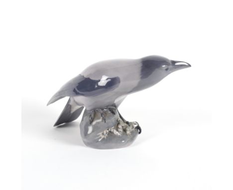 A LARGE ROYAL COPENHAGEN `CROW WITH FROG'Mid 20th century
Modelled by Christian Thomsen ( 1860-1921), green printed and blue 