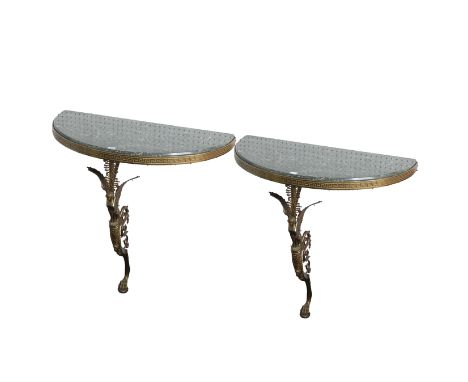 A PAIR OF MODERN MARBLE TOP DEMI-LUNE CONSOLE TABLES (2)On gilt metal winged caryatid monopedia  supports, 92cm wide; 46cm de