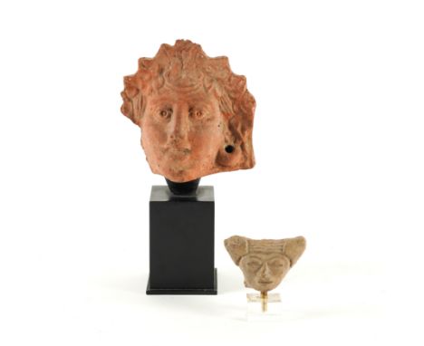 A MEXICAN POTTERY HEAD FRAGMENT AND ANOTHER FEMALE HEAD (2)Teotihuacan, 100BCE-700CE
Of triangular form, mounted on a Perspex